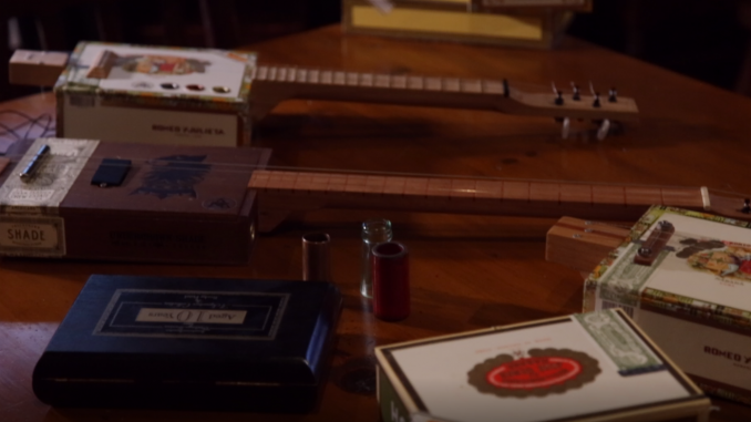 Cigar+box+guitars+rose+to+prominence+as+improvised+guitars+for+those+who+couldn%27t+afford+a+normal+guitar.