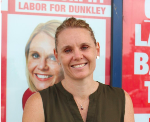 Labor candidate Peta Murphy in front of campaign signage at her campaign office in Carrum Downs