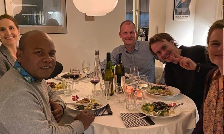 A group of people sitting at a dinner table