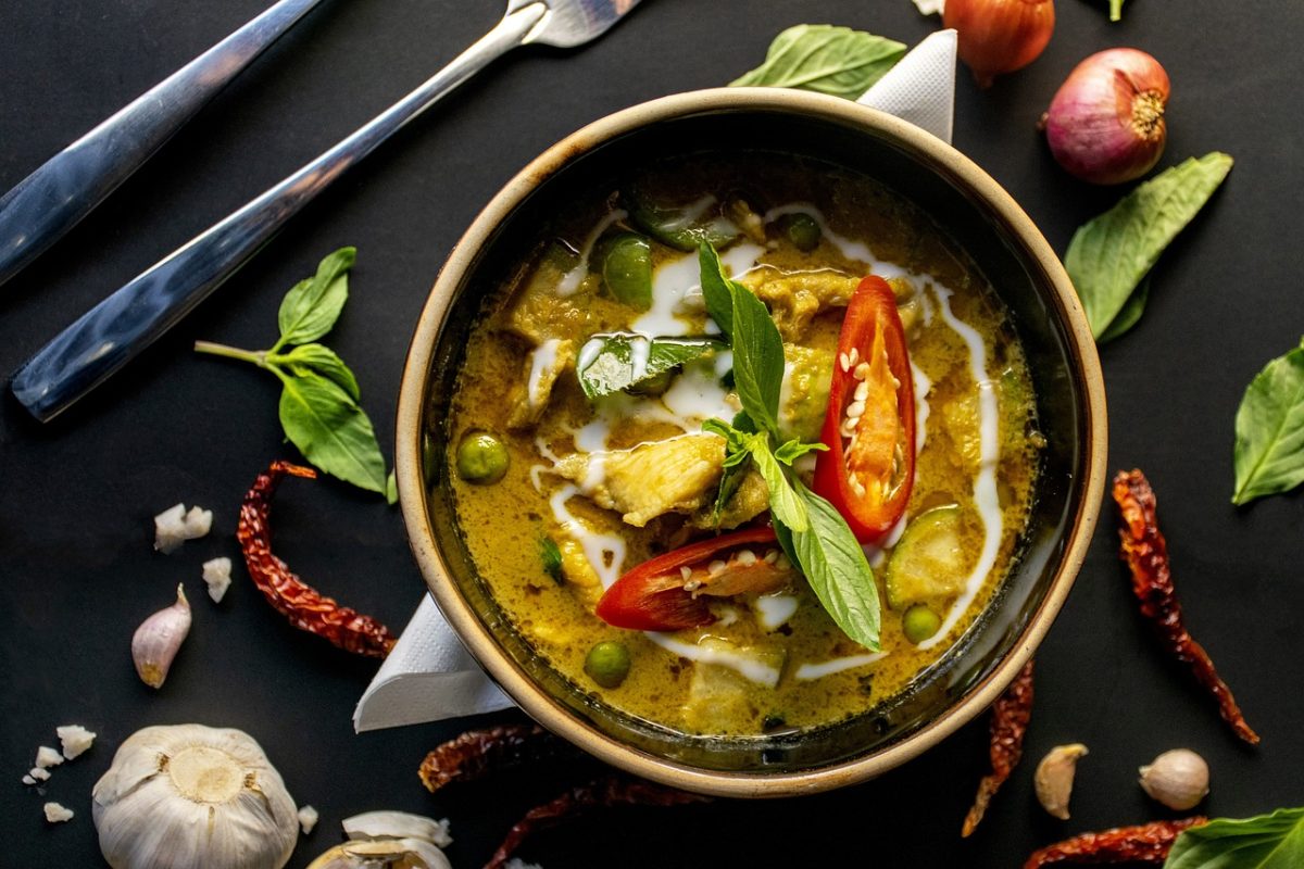 A bowl of soup with meat and vegetables