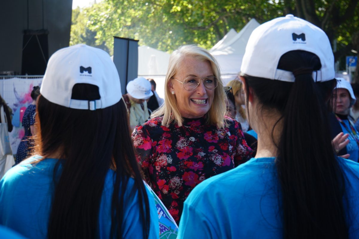 A person standing in front of a crowd of people