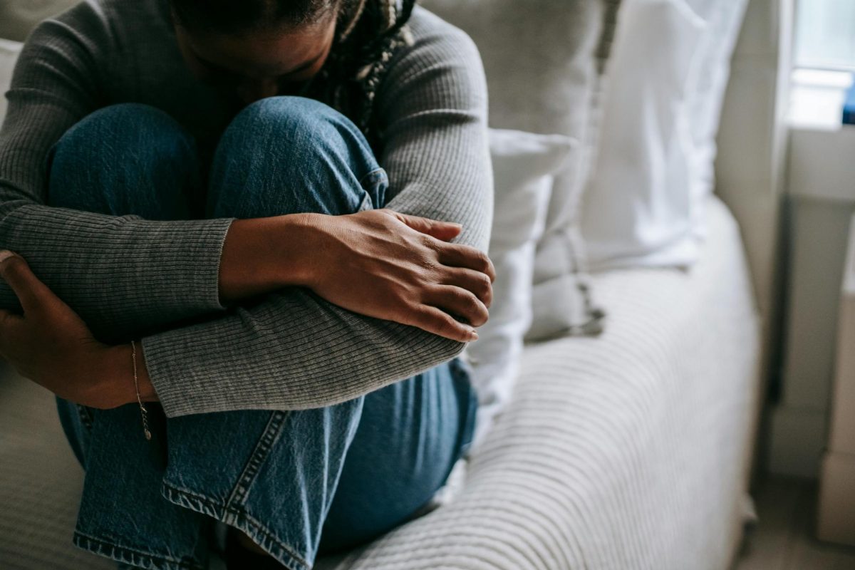 A person sitting on a bed