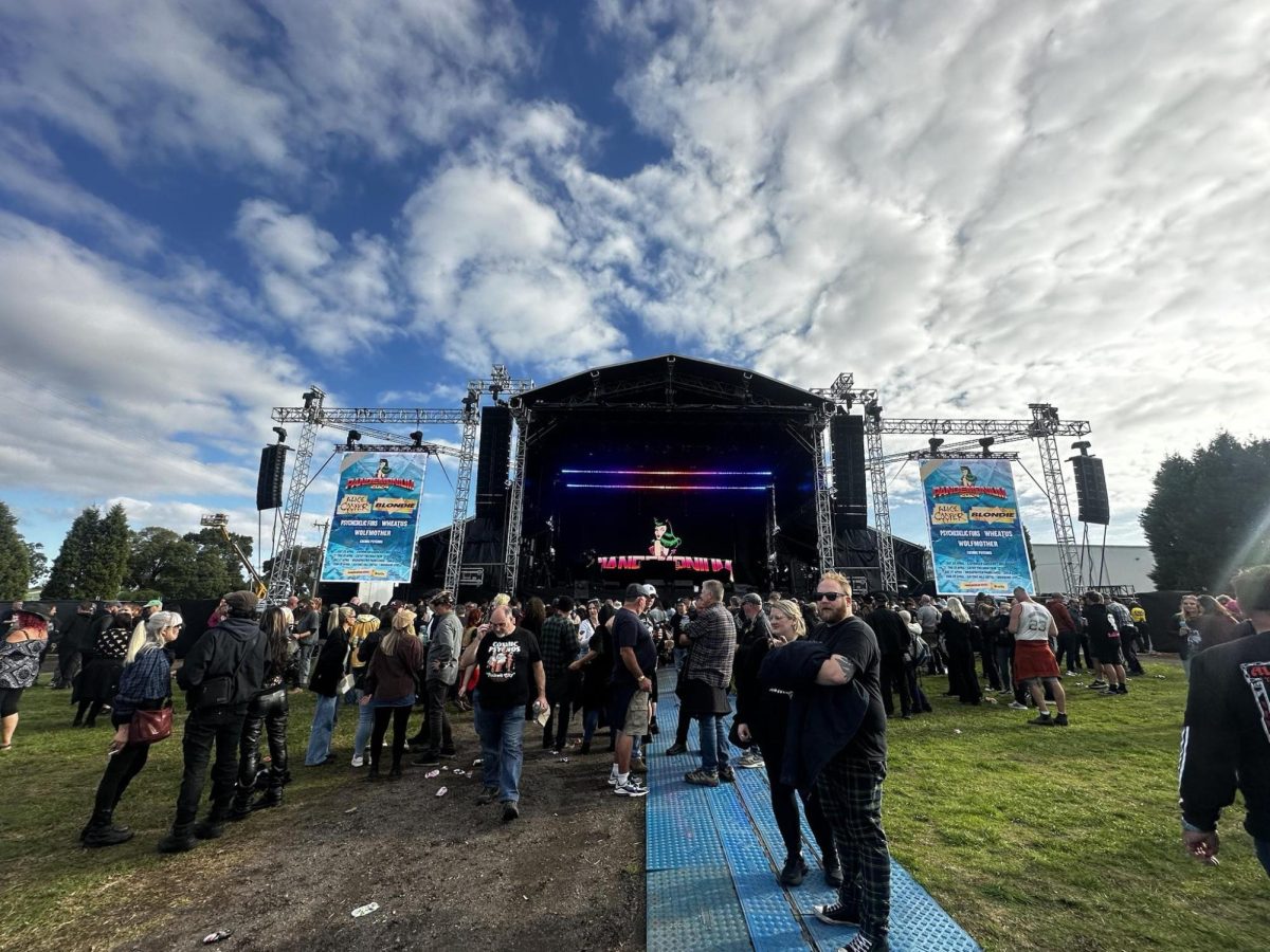 A group of people standing in front of a crowd