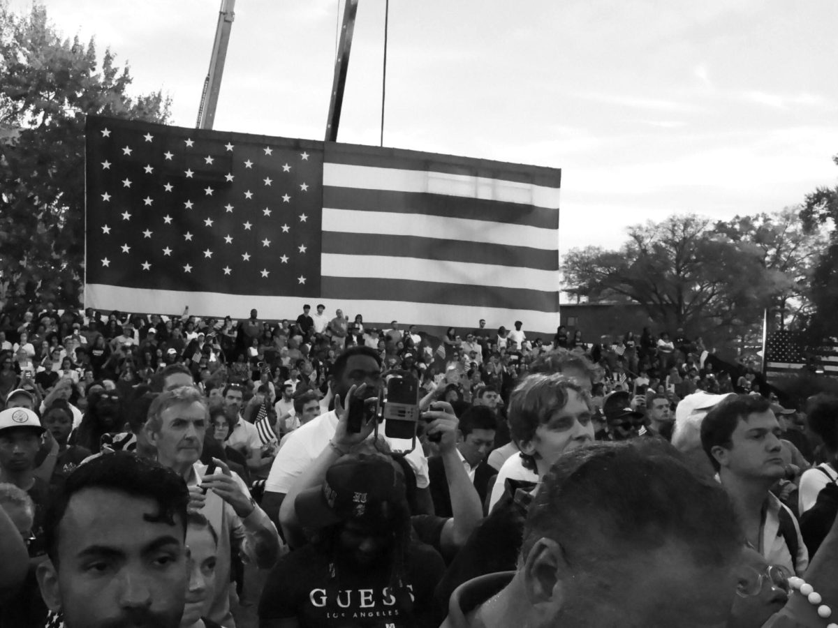 A group of people standing in front of a crowd