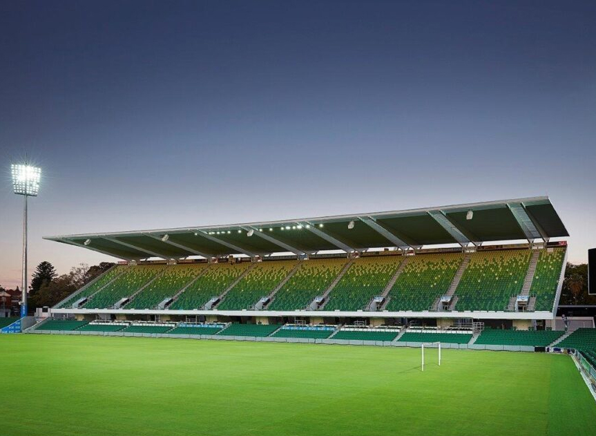 A large stadium with green grass