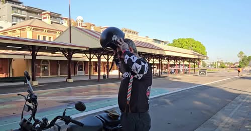 A person standing in a parking lot