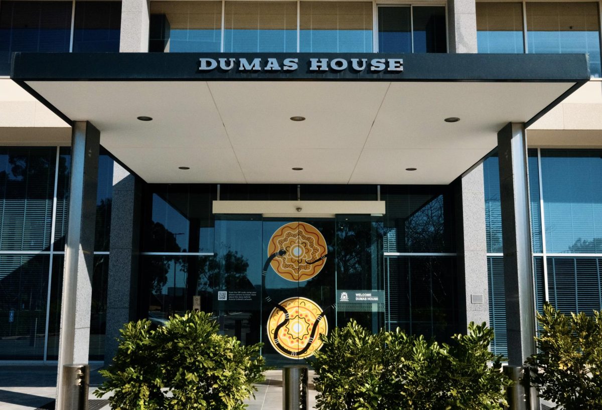 Entrance to Dumas House, with Indigenous art work on the doors